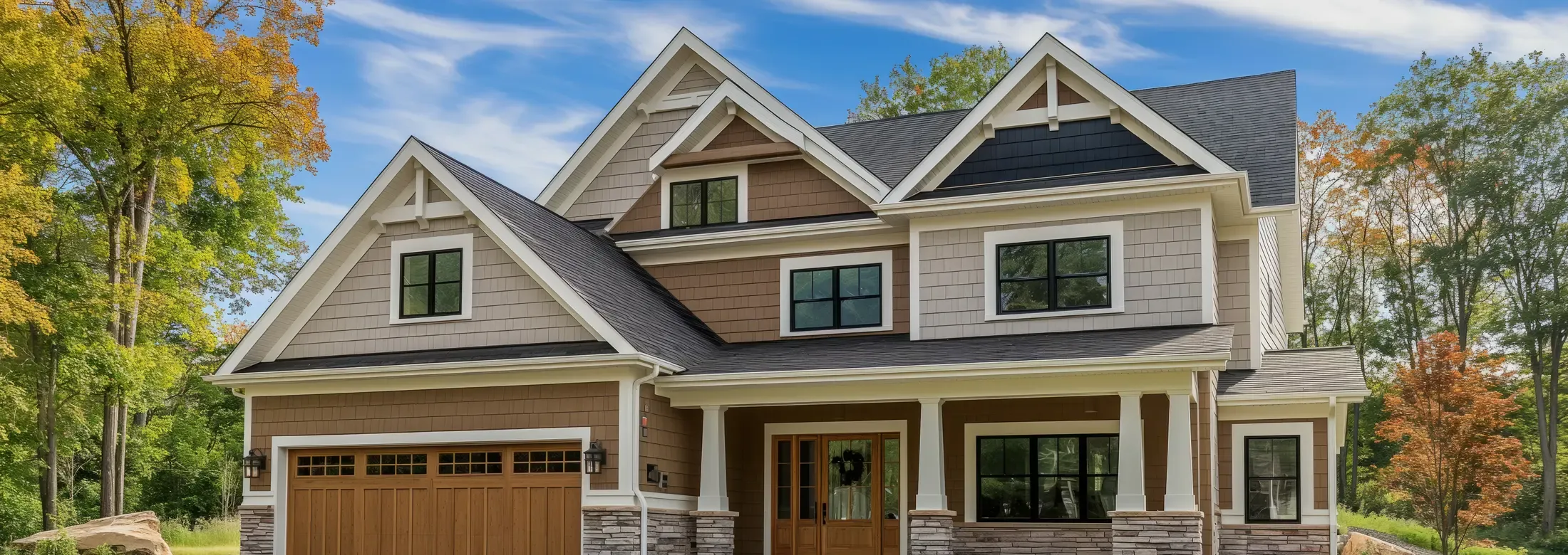 modern craftsman style home with a clean roof and windows